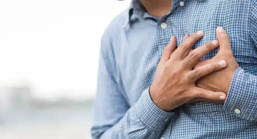 Man with chest pain, possible symptom of heart attack or heart problem