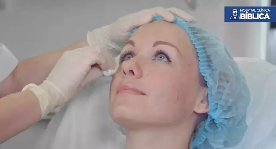 Surgical cap patient receiving preparation for eye surgery
